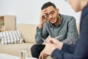 a man talking to his doctor about starting benzo rehab