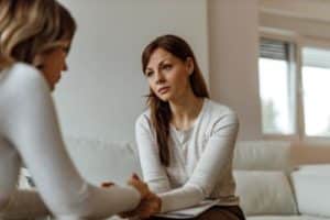 a woman talking to her loved one about depression treatment