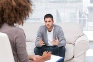 a man talking to his doctor about meth rehab