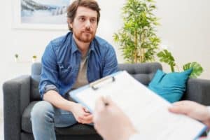 Man in blue shirt engaging in cbt for drug addiction