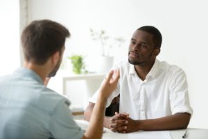 Man and therapist discuss cbt for dual diagnosis