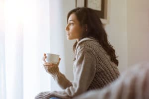 woman holding coffee cup preparing for php