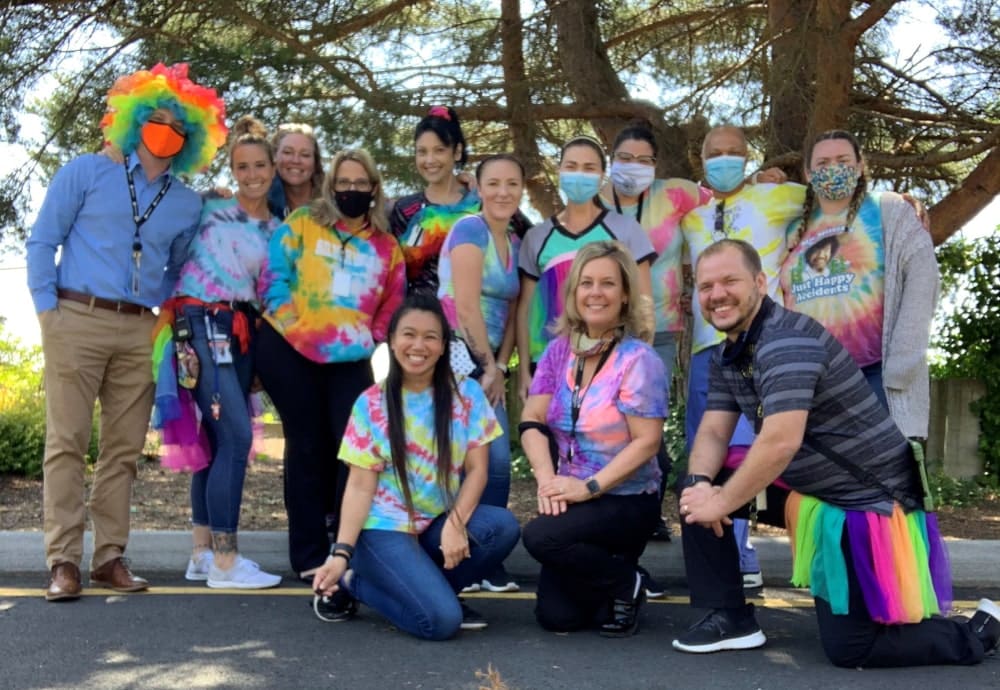 group-posing-with-colorful-shirts.jpg