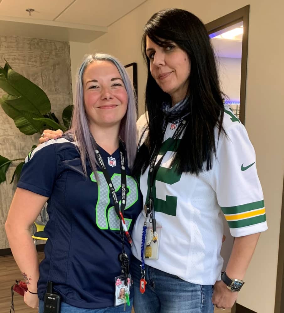 two-women-in-sports-shirts.jpeg