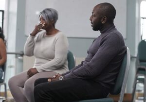 Two participants sitting together at a fentanyl rehab treatment session