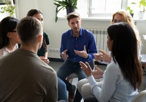 Man talks to his peers while healing in cocaine rehab
