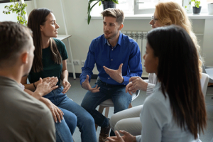 People sitting in a circle at a painkiller rehab program