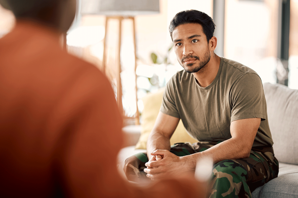 Man asks therapist, "how can cognitive-behavioral therapy help with PTSD?"