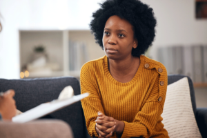 Woman listens to therapist when she explains what to expect when you start recovery