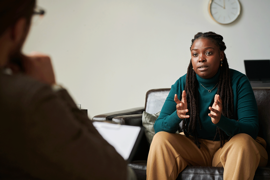 Woman talks to therapist about seeking dual diagnosis treatment in Omaha, NE